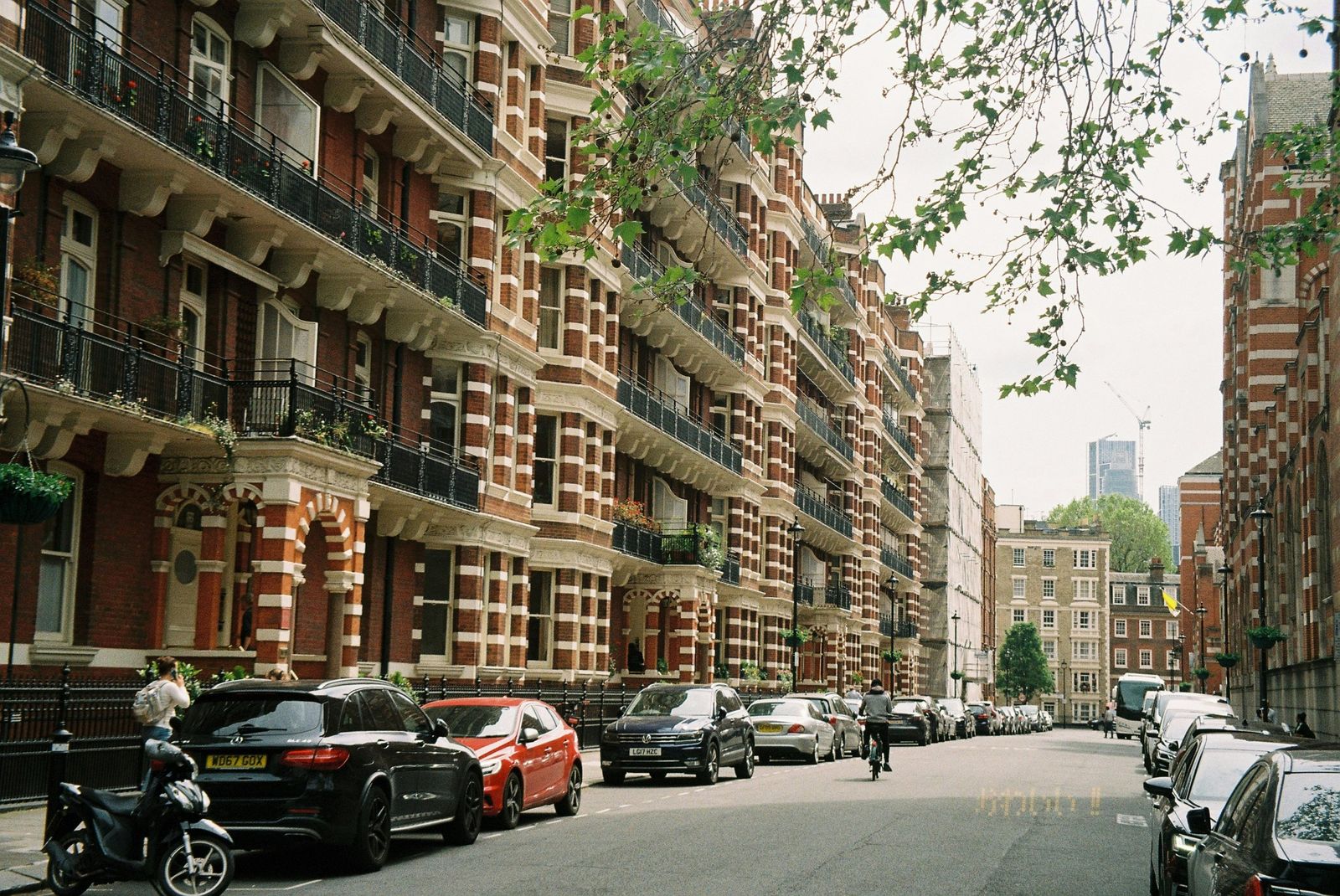 Red-brick mansion blocks along a street